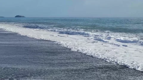Slow motion of waves rushing towards the shore. Stock Footage 197143686