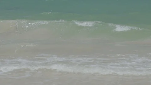 Slow Motion Waves on a Sandy Beach Stock Footage 100984713
