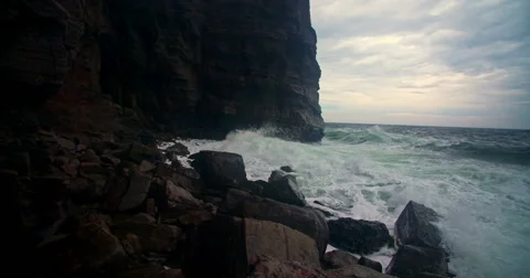 Slow motion, waves on the stone shore, tracking shot. Russian Far East Видео 67459472