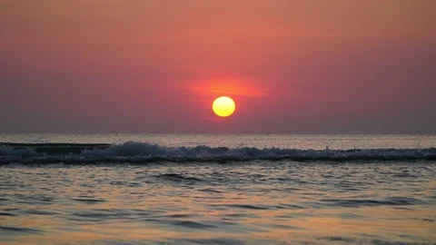 Slow-motion of waves with the sunrise background. Stock Footage 122161723