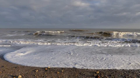 Slow motion waves at sunrise Stock Footage 99091009