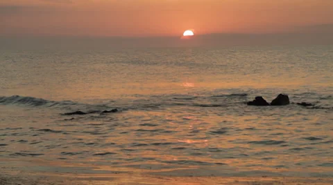 Slow motion of waves at the sunset along an South Italian beach Stock Footage 37861342