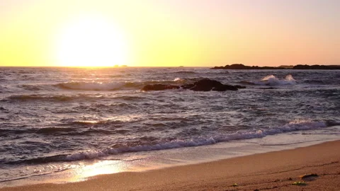 Slow motion waves at sunset Stock Footage 131886912