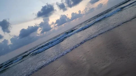 Slow-Motion Waves Under the Sun and Clouds Stock Footage 237077527