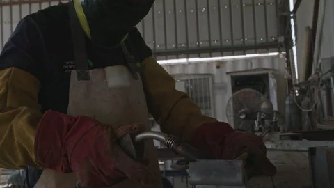 Slow motion of a welder welding construction steel frames Stock Footage 109450655