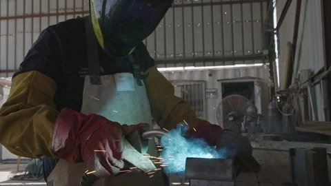 Slow motion of a welder welding construction steel frames Stock Footage 109450998