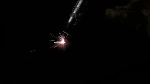 Slow Motion welding in dark workshop with sparks flying Stock Footage 73155042