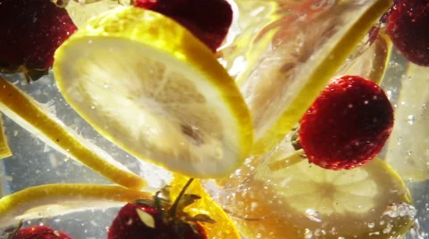 Slow Motion Whirlpool with Sliced Lemon and Strawberry 스톡 동영상 68636121
