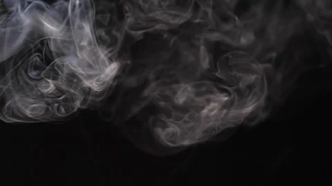 Slow motion of white abstract cigarette smoke on black background Stock Footage 138552505
