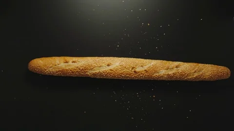 SLOW MOTION: White Baguette Falling Down On A Black Surface Stock Footage 114797243