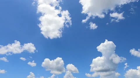 Slow motion white cloud n fluffy cloudscape moving on sunny blue sky Stock Footage 167904320