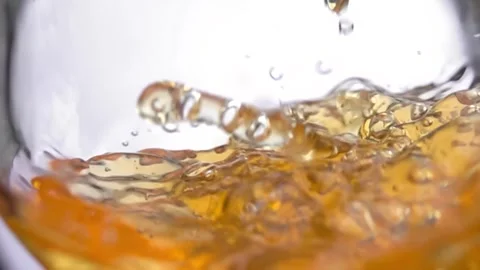 Slow motion White grape Juice pours into a glass Stock Footage 325897119