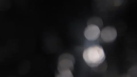 Slow motion of white lights scattered across the screen 스톡 동영상 317452173