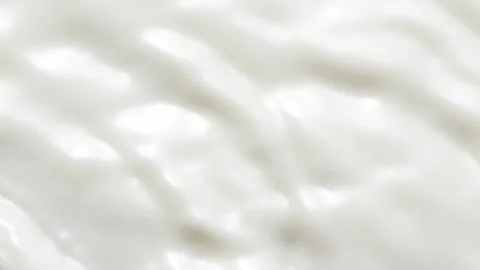 Slow motion white liquid cream ripples, close-up fresh milk drink splash texture Vídeos de archivo 241477786