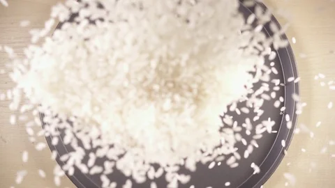 Slow motion white long grain rice drops down Stock Footage 92088695