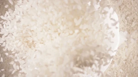 Slow motion white long grain rice drops down Stock Footage 92088809