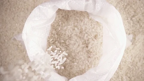 Slow motion white long grain rice drops down Stock Footage 92088909