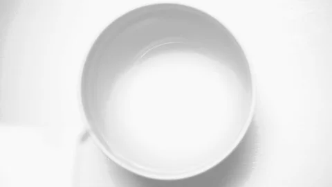 Slow motion white milk in a white cup Stock-Footage 72152658