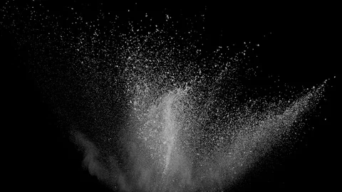 Slow motion white powder explosion on black background. Vidéo 122438173