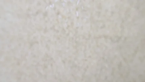 Slow motion white rice pouring into o a pile from above Stock Footage 88344230