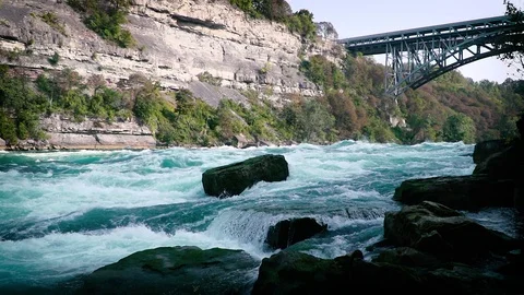 Slow Motion White Water Rapids Under Bridge Stock Footage 80468730