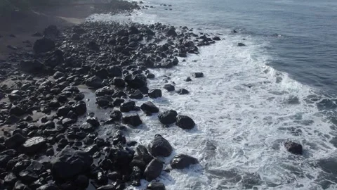 Slow Motion White Waves Crashing on Dark Basalt Volcanic Rocks Stock Footage 327635578