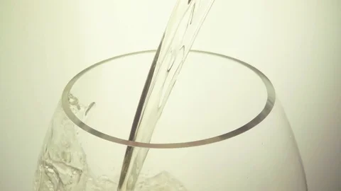 Slow motion white wine on a white background Video stock 73131772