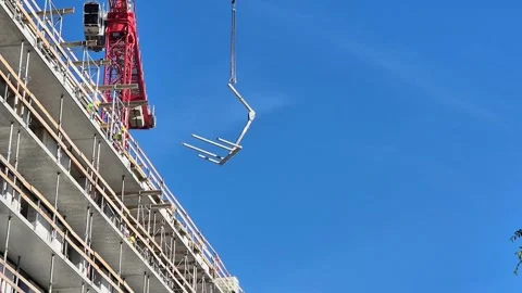 Slow Motion Wide Shot of Crane Hoisting Doka Staxo and Railing Install Stock Footage 340829852