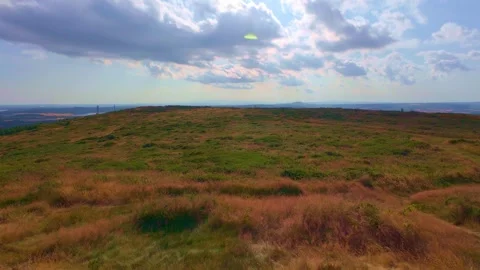 Slow motion wide view of hill summit horizon under sky Stock Footage 340441404