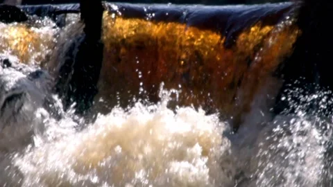Slow motion of wild river. Seething streams of water in the sun rays. Stock Footage 185752224