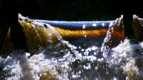 Slow motion of wild river. Seething streams of water in the sun rays. Stock Footage 185752267