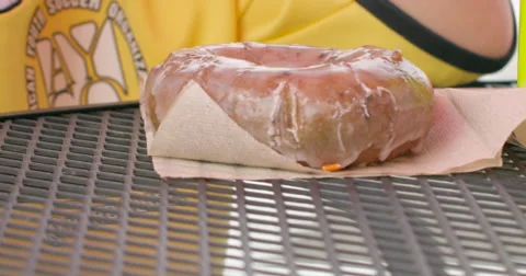 Slow Motion Wind Blowing a Napkin with a Donut on It. Stock Footage 61468150