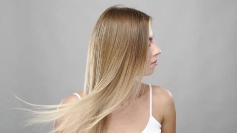 Slow motion of wind develops the blonde hair Stock Footage 146598764