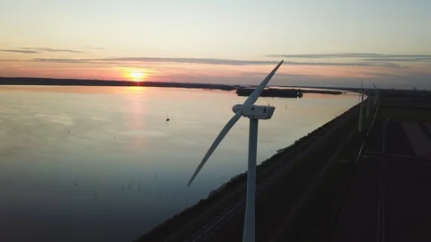 Slow motion wind turbine with a nice sunset Stock Footage 95937531