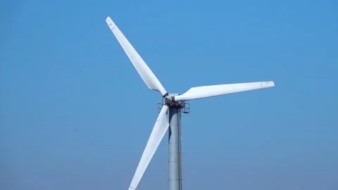 Slow motion. windmill for electricity generation against blue sky Stock Footage 191962129