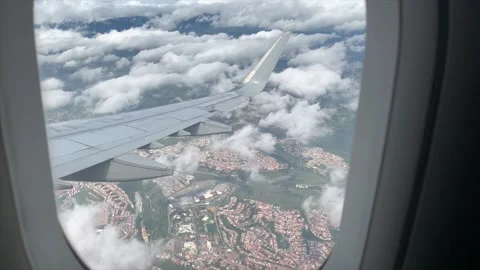 Slow Motion Window View Video Of Plane Landing On Sunny Day Video stock 166654255