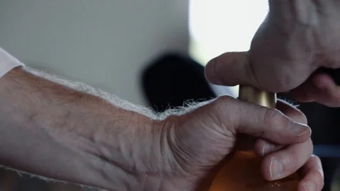 Slow motion of wine bottle being opened Stock Footage 100296272