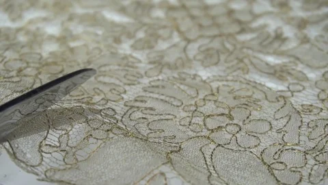 Slow motion of a woman hand using a scissor to cut a fabric, on 16 December 2017 Stock Footage 83490133
