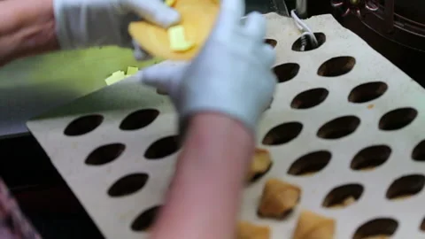 Slow Motion: Woman hands putting paper inside fortune cookie - San Francisco, Ca Stock Footage