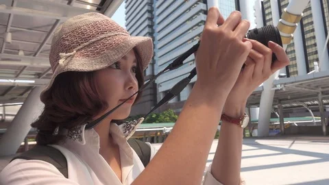 Slow motion - woman using camera while travel at downtown in Bangkok, Thailand. Stock Footage 97557909