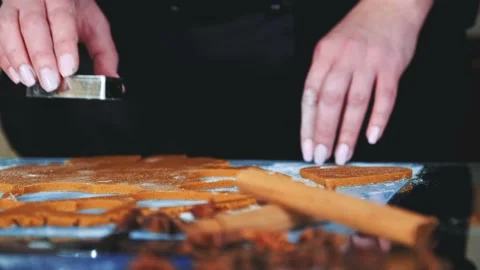 Slow motion of woman's hands using cookie cutter to make cookies Stock Footage 131540551
