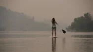 Slow Motion Of Women Floating On Paddleboard Stock Footage