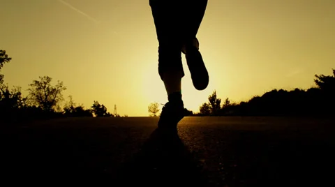 SLOW MOTION: women running at sunset Stock Footage