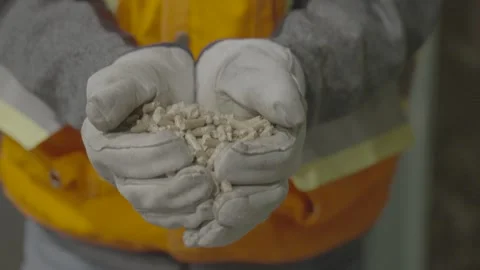 Slow Motion of Wood Pellets Falling from Gloves, 120 FPS Stock Footage 318322086