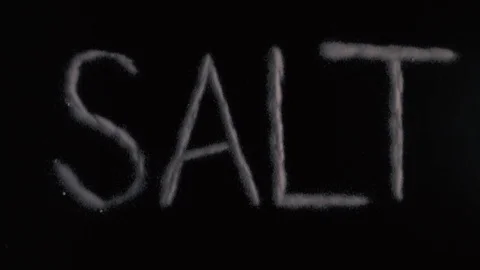 Slow motion word salt written on a black background Stock Footage 71976748