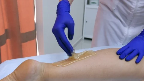 Slow motion work master of sugaring Stock Footage 97097992