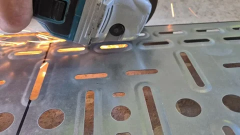 Slow motion of worker cutting metal cable tray with grinder 스톡 동영상 343755772