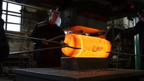 Slow Motion Worker Group Operate with Red Hot Metal Piece Stock Footage 78994585