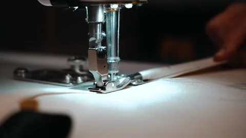 Slow motion worker using sewing machine Stock Footage 135269762