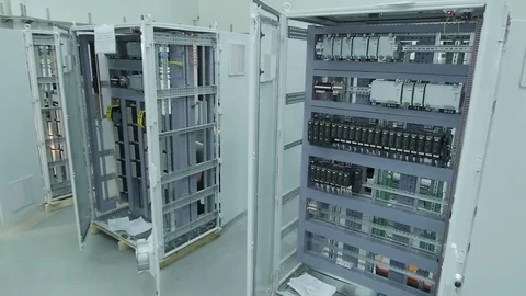 Slow Motion Workers Equip Switchboards in Factory Workshop Stock Footage 79602128